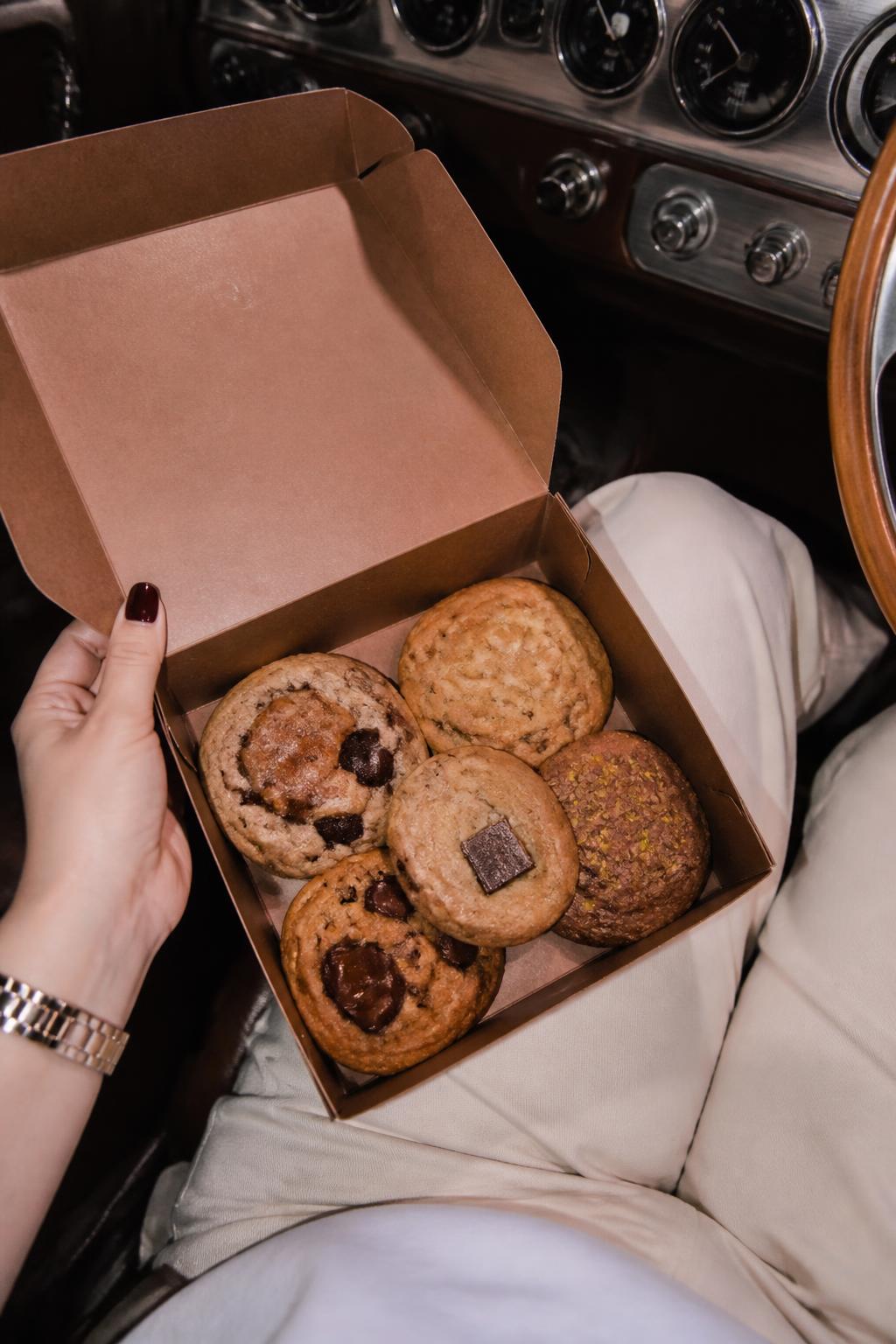 A box of cookies inside a vintage car